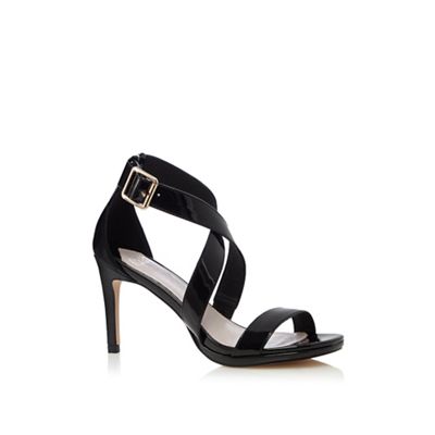 Black patent 'Daisy' crossover sandals